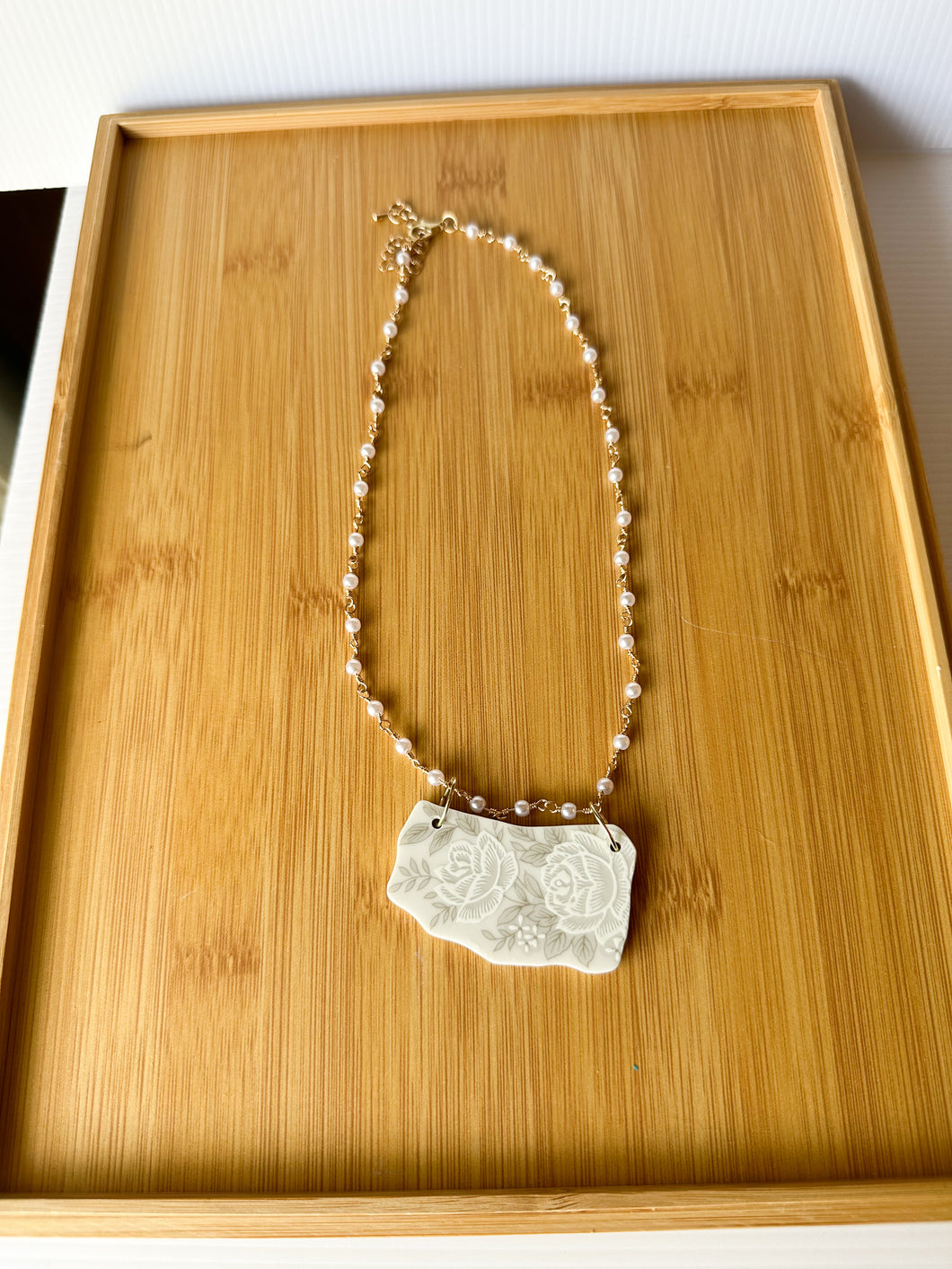 White and Grey Floral Plate Piece with a Pearl Chain